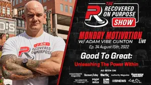 Man with tattoos and folded arms stands confidently in front of a brick building. Text: "The Recovered On Purpose Show" and "Monday Motivation Live." Episode date: August 15th, 2022.