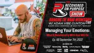 Bald man with tattoos working on a laptop in an outdoor cafe setting. Text promotes "The Recovered on Purpose Show" episode on managing emotions.