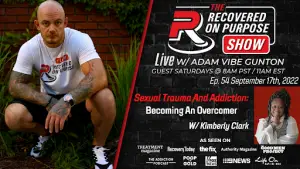 The image shows a promotional poster for "The Recovered On Purpose Show" featuring Adam Vibe Gunton, squatting with folded hands in a grassy area. It details an episode airing on September 17th, 2022, titled "Sexual Trauma and Addiction: Becoming An Overcomer," with guest Kimberly Clark. Logos of media outlets where the show has appeared are included at the bottom. The tone is supportive and inspirational.