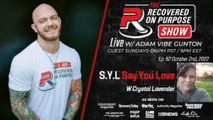 Banner for 'The Recovered on Purpose Show' featuring Adam Vibe Gunton. Smiling man in a white shirt on the left, and a smaller photo of a woman on the right. Text highlights an episode with Crystal Lavender, airing Sunday, October 2nd, 2022. Logos of various featured media outlets are displayed below.