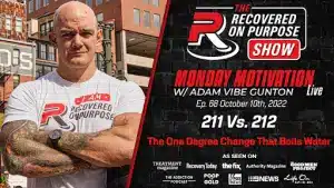 Bald man with tattoos stands confidently in a branded shirt against an urban backdrop, promoting "The Recovered on Purpose Show" on Monday Motivation.