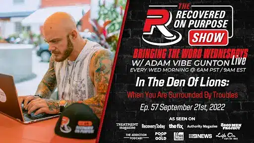 A tattooed man types on a laptop outdoors near a "Recovered On Purpose" hat. Text details a live show with Adam Vibe Gunton on September 21, 2022.