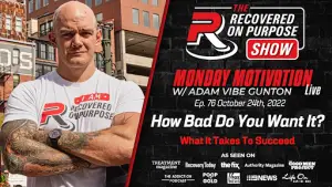 Bald, tattooed man in a "Recovered On Purpose" shirt stands with arms crossed, smiling. "Monday Motivation" show details and logos are on the right.