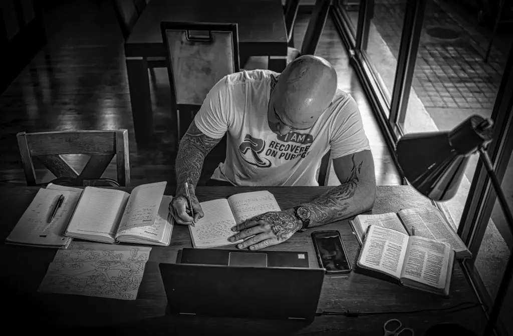 Journaling at my desk in my addiction recovery as a relapse prevention technique