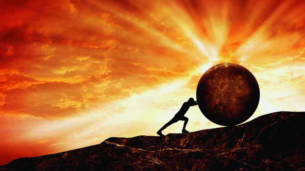 A silhouette of a person pushing a large boulder uphill against a dramatic, orange sunset sky. The scene evokes struggle and determination.