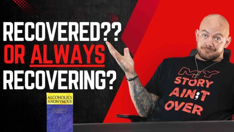 A bald man with tattoos shrugs while seated, wearing a shirt saying "MY STORY AIN'T OVER." Text reads "Recovered?? Or Always Recovering?" with an Alcoholics Anonymous book visible. The tone is contemplative.